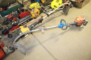 A Flymo XLT 2500 petrol strimmer