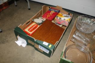 A box containing fish knives and forks; die-cast vehicles; harmonica etc.