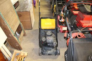 A petrol lawn mower with Briggs and Stratton engin