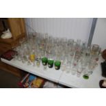 A collection of advertising drinking glasses