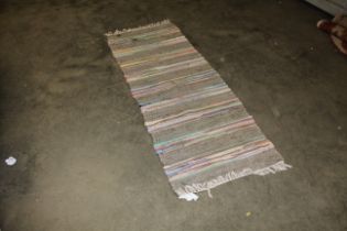 An approx. 6'8" x 2'4" rag type rug AF