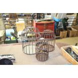 A set of three graduated bird cages (169)