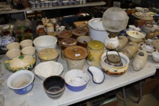 A collection of storage jars, stoneware hot water