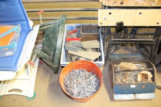 A metal bin and contents of nails and a plastic cr