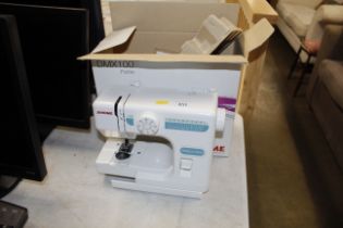 A Janome electric sewing machine (lacking power cable)