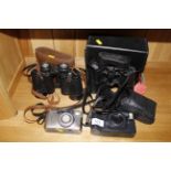 A pair of Swallow 10 x 50 binoculars; a Russian 12 x 40 binoculars and two cameras