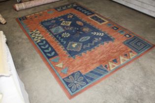 An approx. 9'2" x 6'3" patterned rug