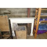 A white painted fire surround