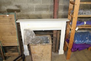 A white painted fire surround