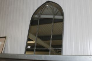 An arch framed wall mirror (148)