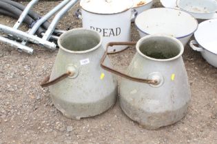 A pair of galvanised milk churns