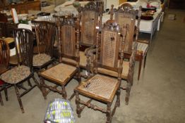 Four carved oak and cane back dining room chairs c