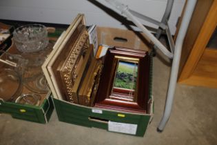 A box of pictures, frames and books