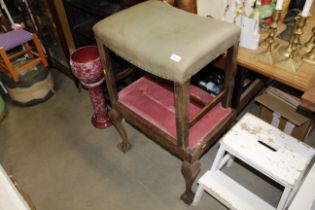 A step stool; and two dressing table stools