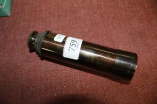 A reproduction brass telescope (83)