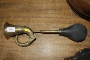 A brass car horn