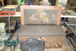 A vintage upholstered bench seat