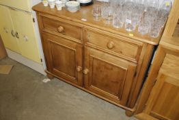 A stripped pine sideboard fitted two drawers