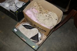 A box containing various linen, and curtain tie ba