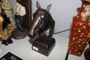 A bronzed model of a horse's head (132)