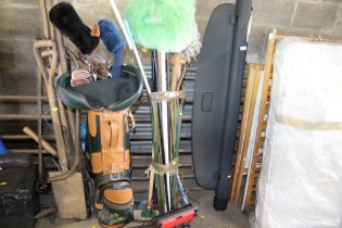 A bundle of various long handled gardening tools e