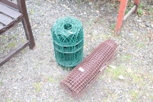 A roll of metal garden edging and roll of plastic