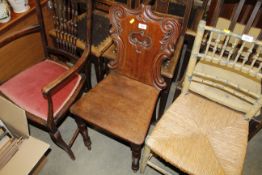 A Victorian carved mahogany hall chair
