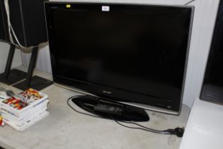 A Sharp television with remote control