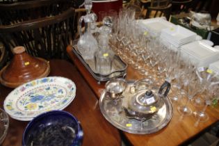 A silver plated three piece tea set on tray; a sil