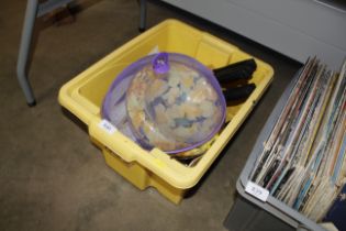 A box containing cutlery and kitchen utensils