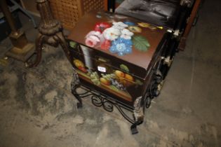 A floral decorated dome topped box on stand