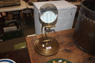 A magnifying glass on stand (92)