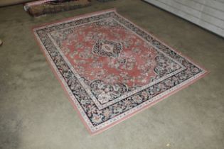 An approx. 7'7" x 5'7" floral patterned rug