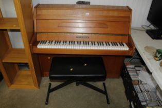 A John Brinsmead upright piano and piano stool