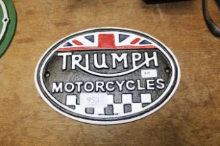 A reproduction metal Triumph Motorcycles advertisi