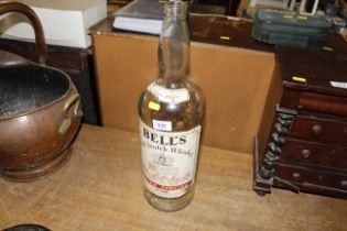 An empty bottle of Bells Scotch whisky