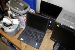 A Toshiba laptop and a Dell laptop