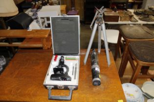 A Greenkat spotting scope with tripod and a cased