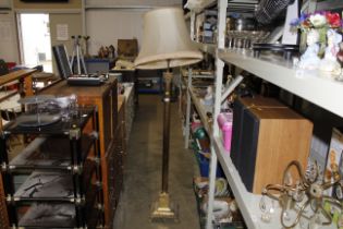 A brass Corinthian column standard lamp