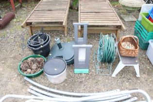 A quantity of garden items to include hose and ree