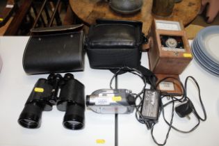 A pair of Crown 16 x 50 binoculars, a Sony Handyca