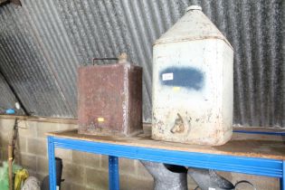A vintage Esso fuel can together with a vintage oi