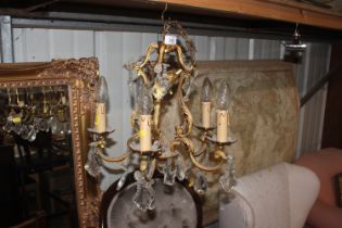 A five branch chandelier with glass drops