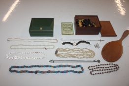 A box containing various bead necklaces, chess pie