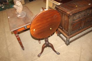 A 19th Century mahogany snap top table, raised on