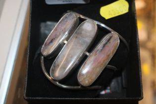 A white metal and hardstone set bracelet