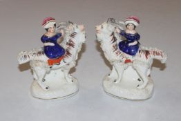 A pair of 19th Century Staffordshire figures depic