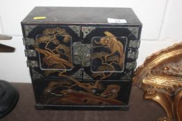 An Oriental lacquered jewellery cabinet