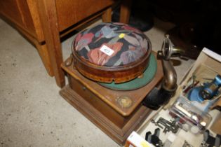 A wind-up gramophone (incomplete) and a circular w