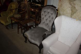 A Victorian spoon back armchair